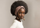 Child girl with afro hair wearing a light brown bowless headband