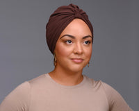 Adult woman wearing a chocolate brown turban