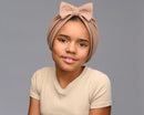 Child model wearing mocha - light brown turban with a bow